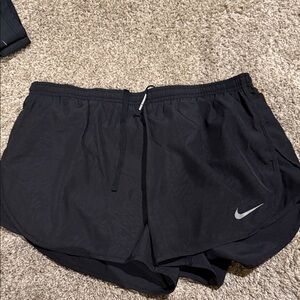 Nike Women’s Black Athletic Shorts with Silver Swoosh